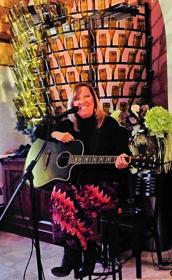 Shirley with all of her empty wine bottles. :) 